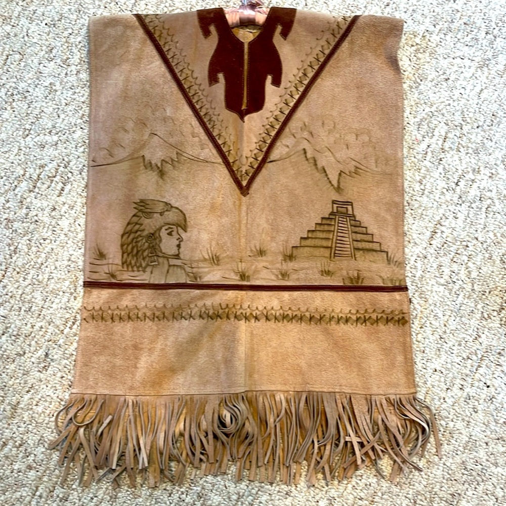 Not available til April

Unique Suede poncho